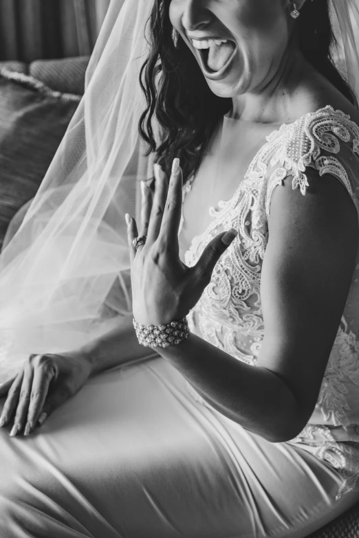 a bride reacts during a ceremony on her wedding day