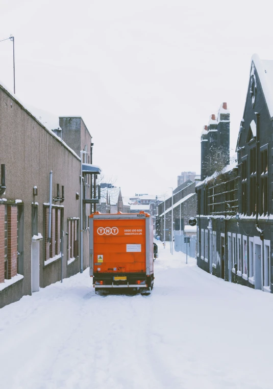 a red truck parked in front of a building