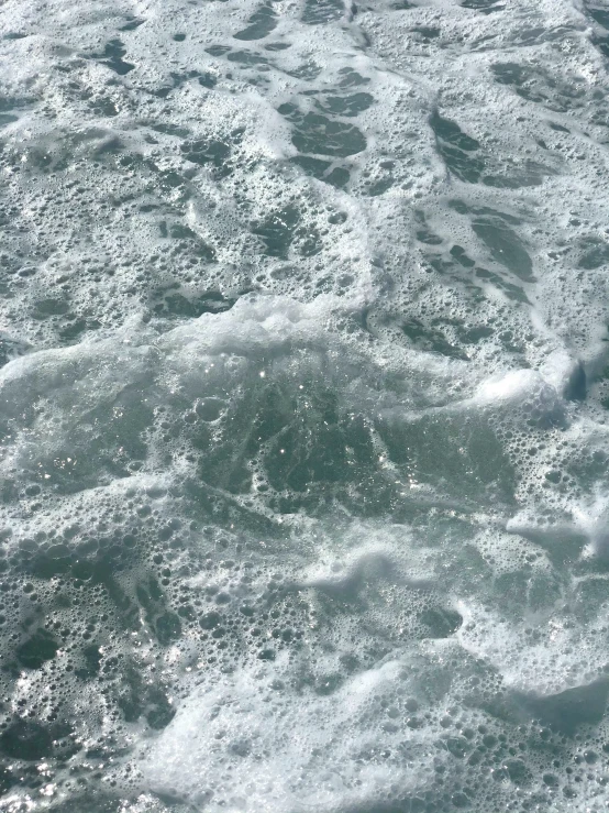 a closeup view of the bottom of some wavy water