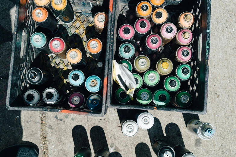 multiple rows of different beer cans sitting on the ground