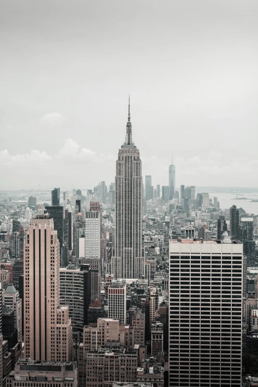 a city skyline is in a dark colored po