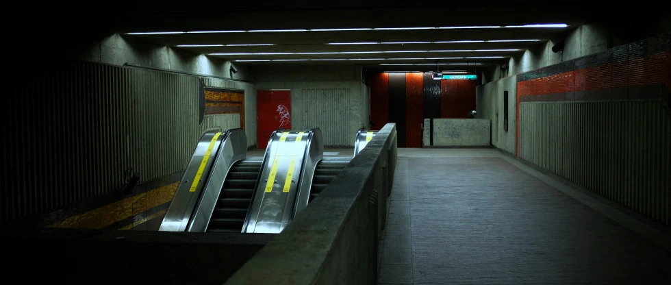 a very empty dark hallway with the doors open