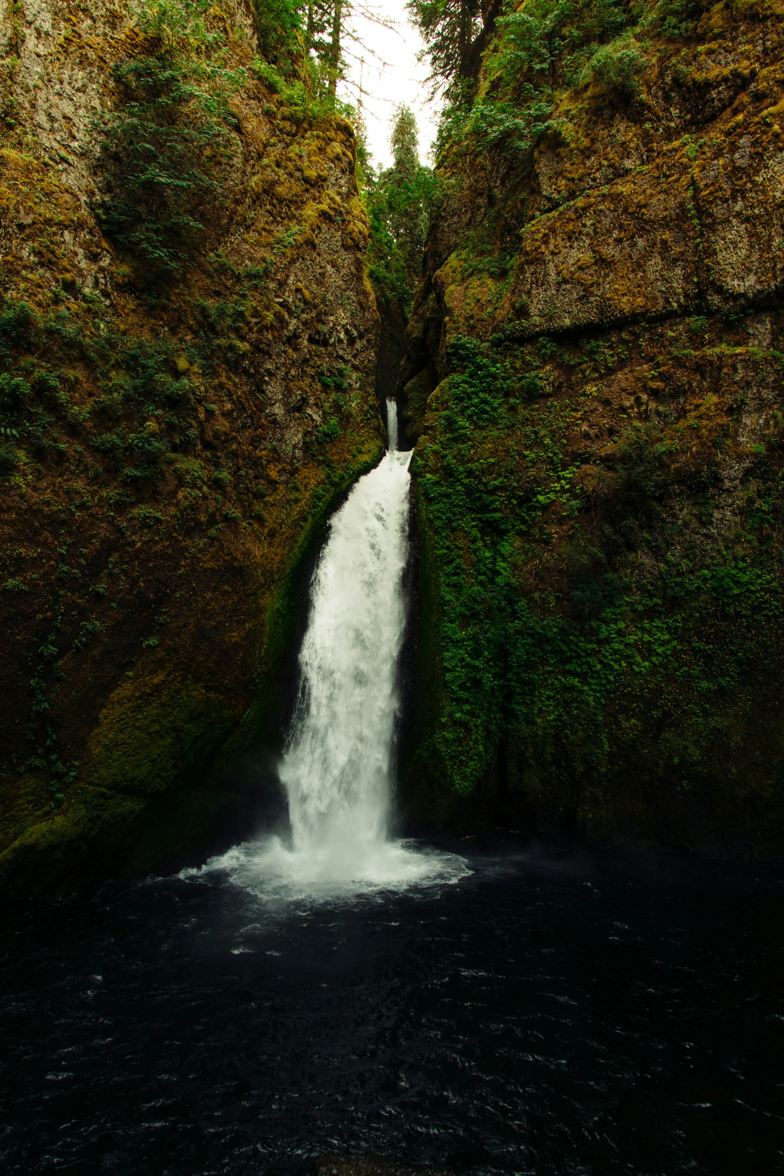 a waterfall with water cascading down it