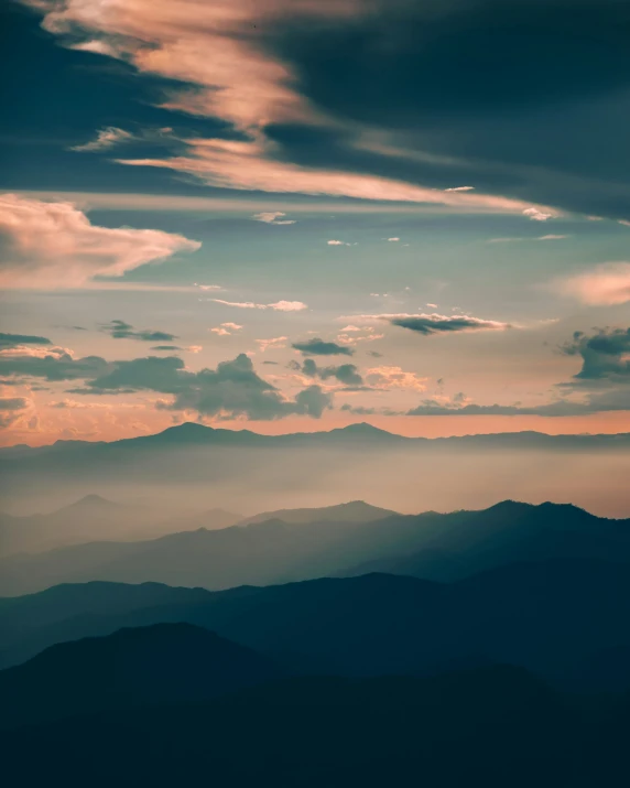 a long s looking down a mountain at sunset