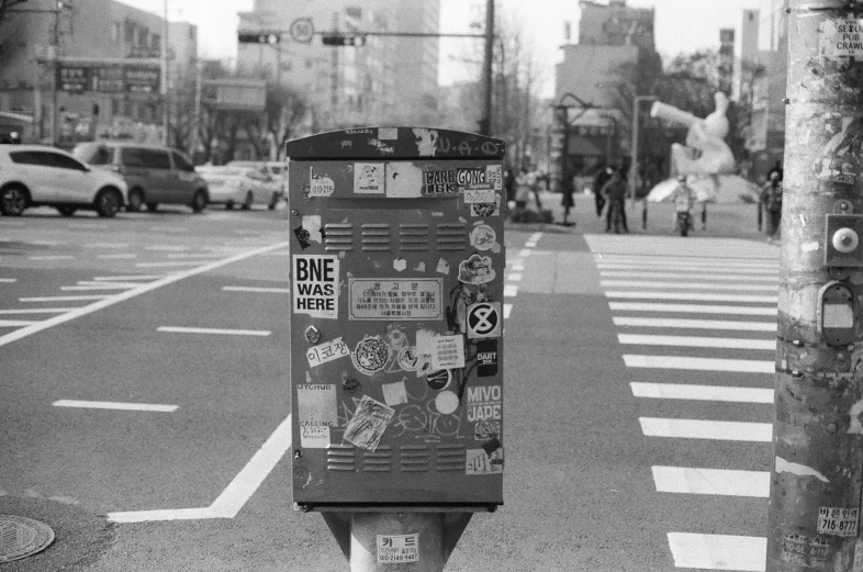 a black and white pograph of a street corner