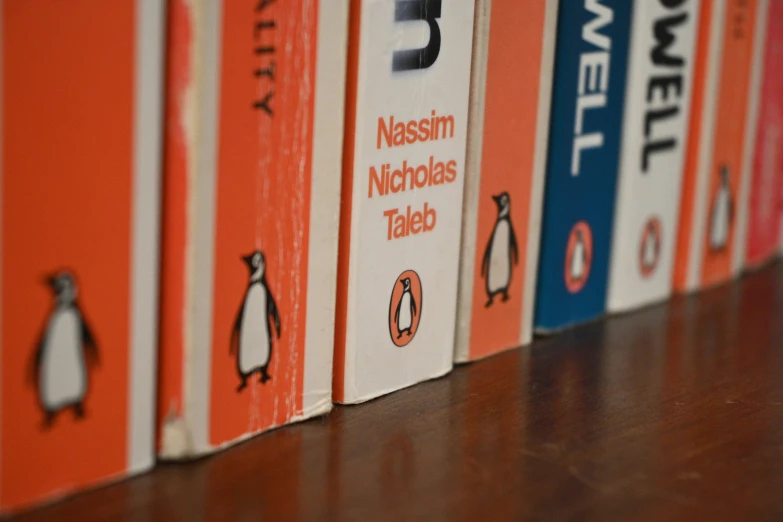 some books are lined up in the shape of penguins