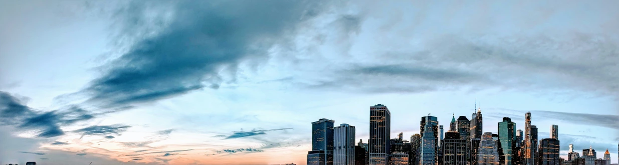 a city at sunset seen from a beach