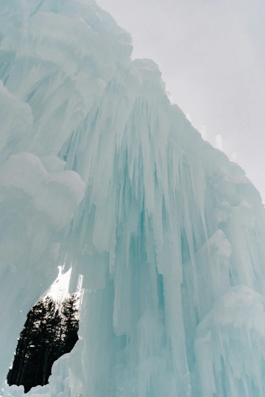 frozen water is coming off the ice on the mountain