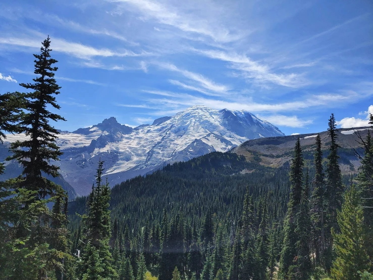 view from the bottom of a mountain covered in snow