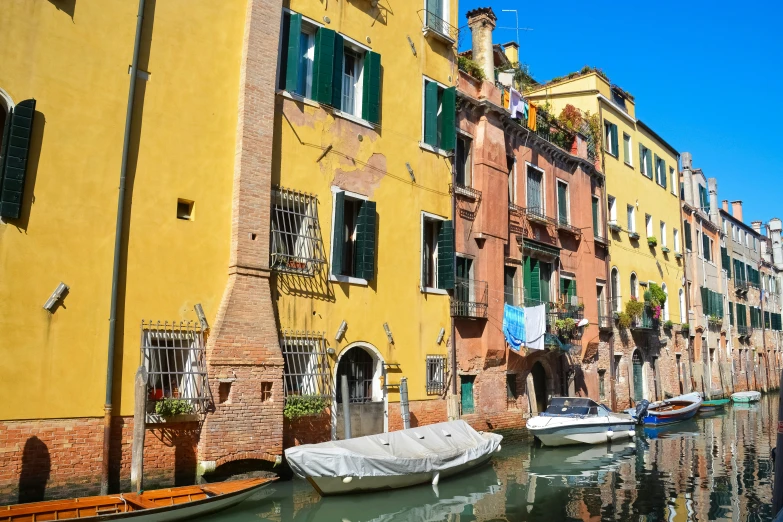 a line of buildings along a river in venice