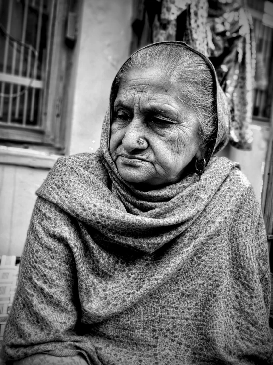 black and white po of an old woman with her head covered