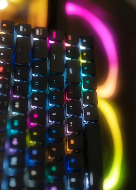 the top of a glowing colored computer keyboard