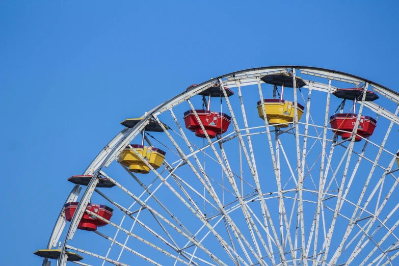 a ferris wheel with several small rides around it