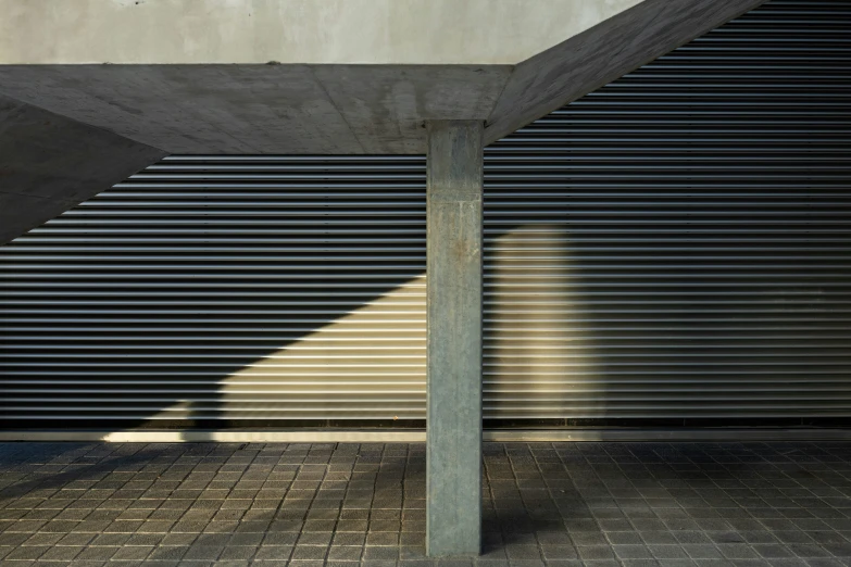 shadow of a person on the wall by a bench