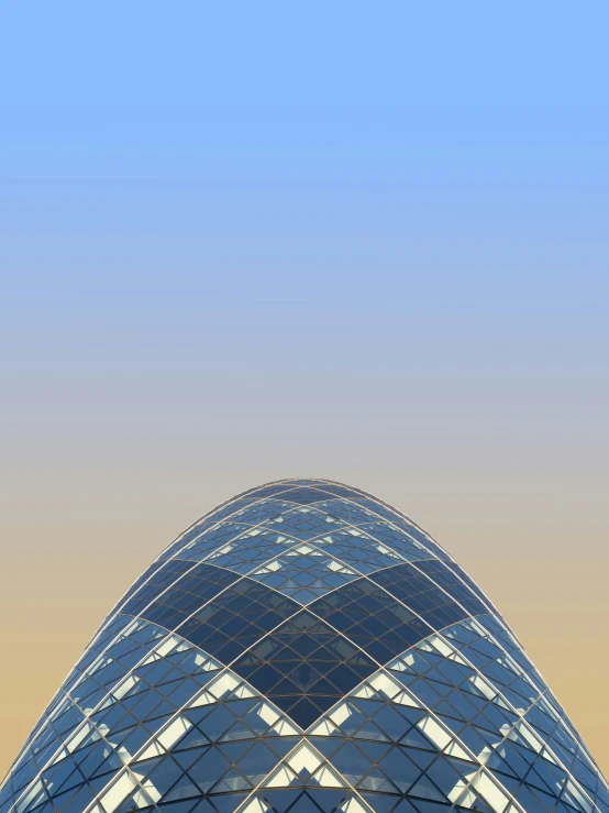 the top of a very tall building near a blue sky