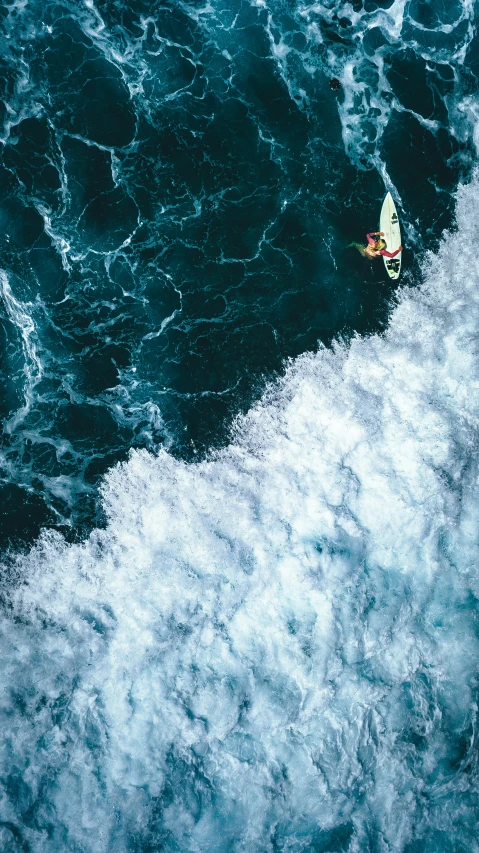 a person riding a surfboard in a body of water