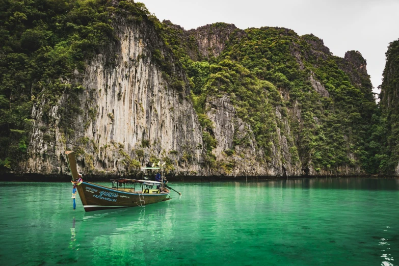 two boats that are floating on the water