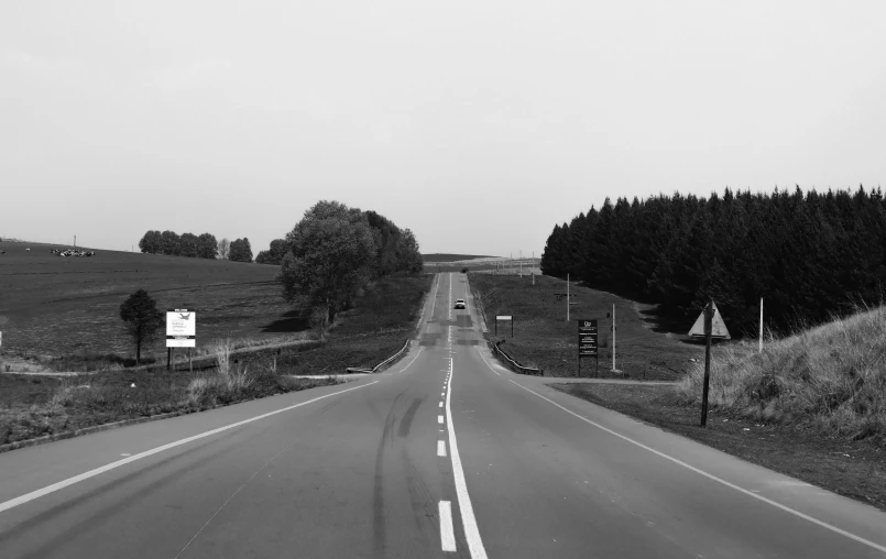 this is a black and white po of a rural road