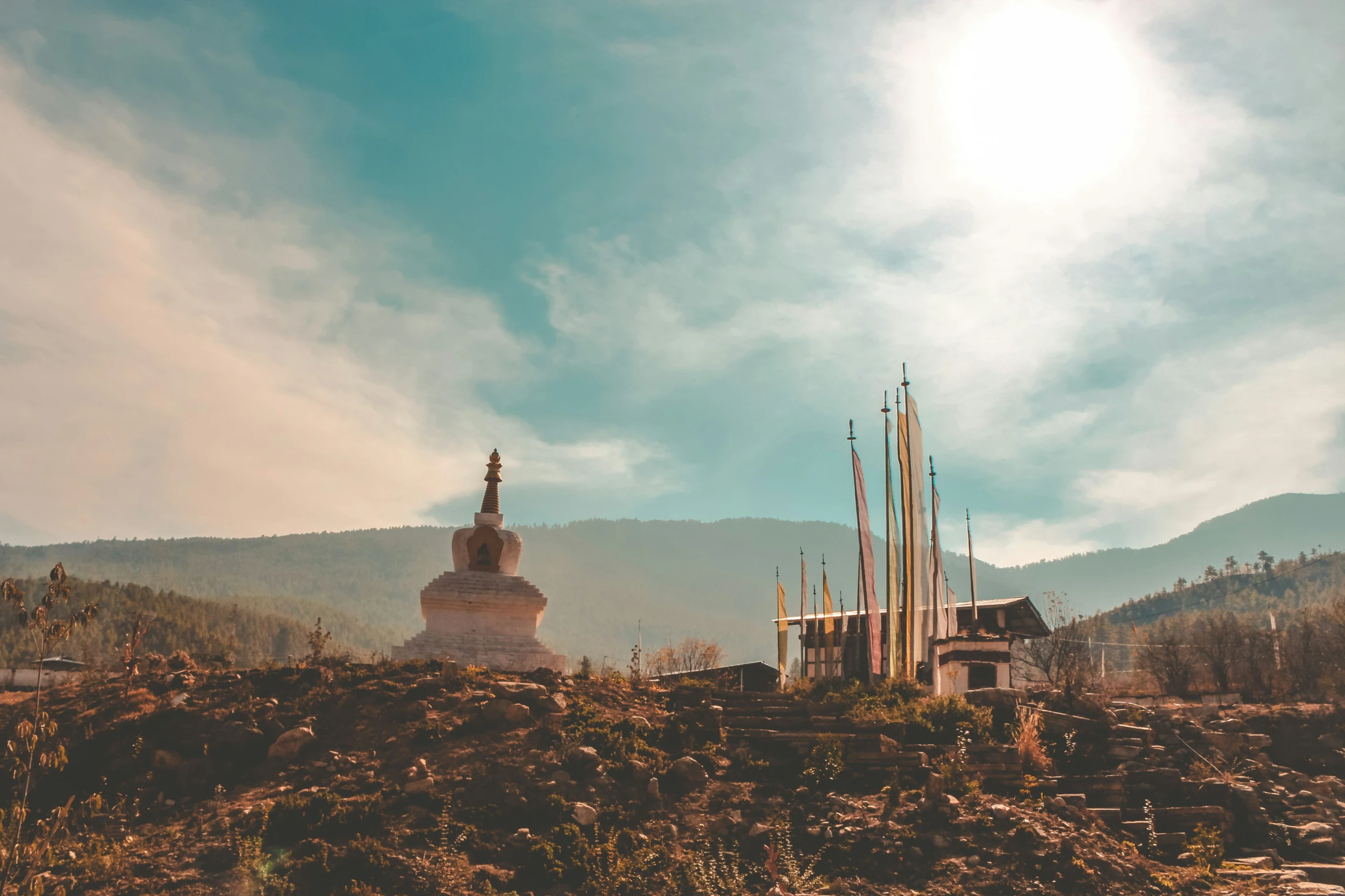 a small church and two spires in the background