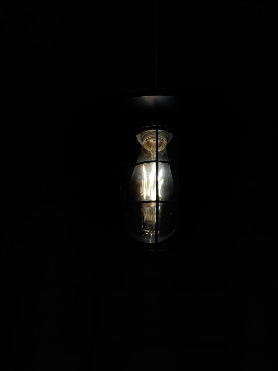 a lantern lite up in the dark