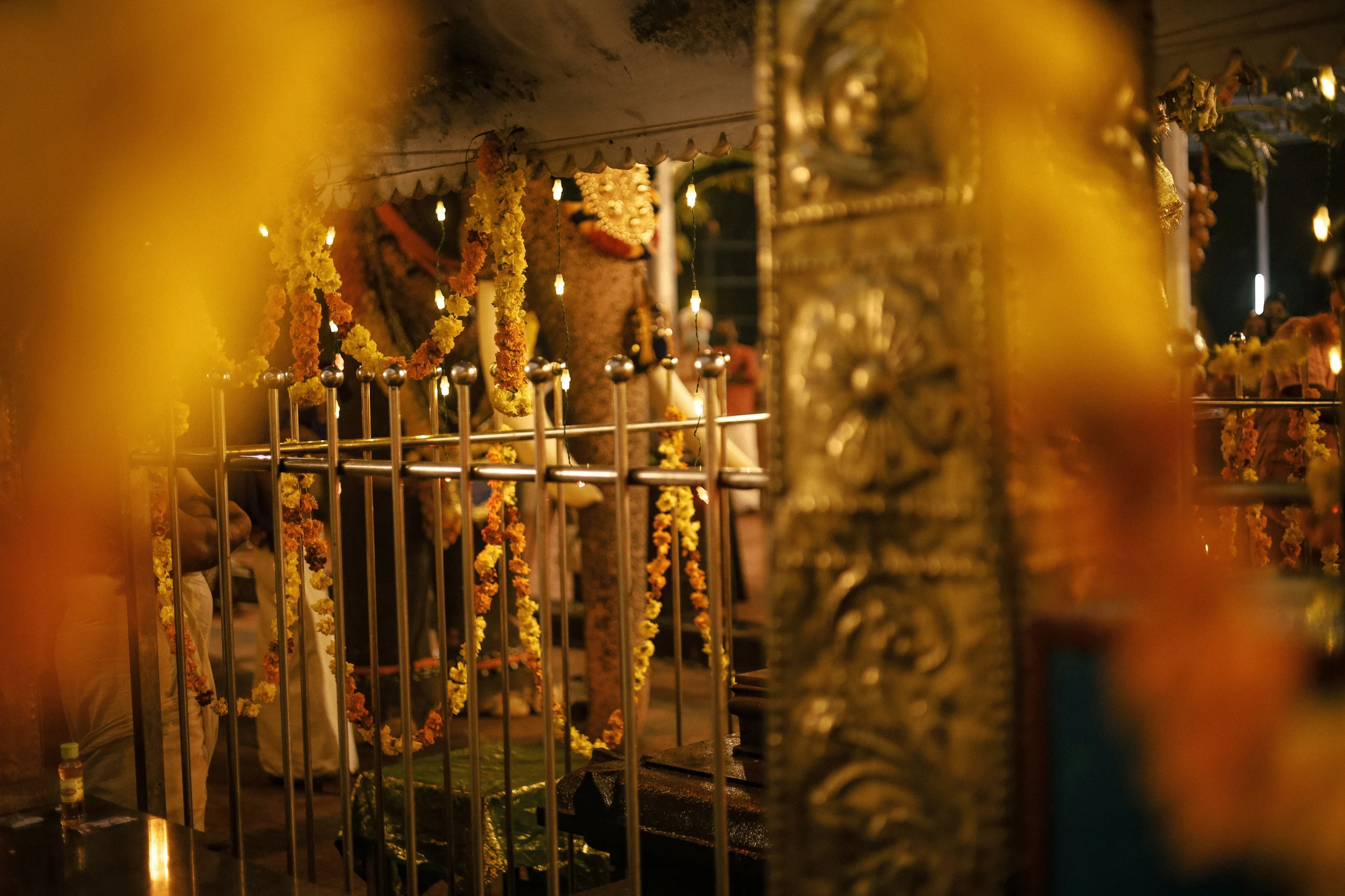 the temple is adorned with different offerings and candles