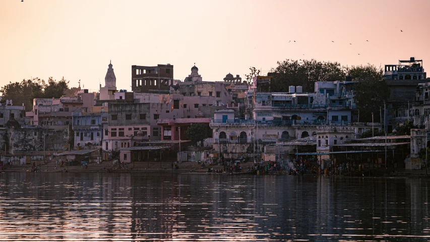 a view of many building type structures in the middle of the river