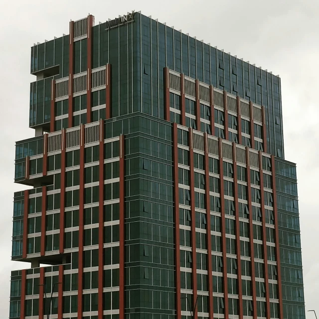 a tall building with lots of windows on top