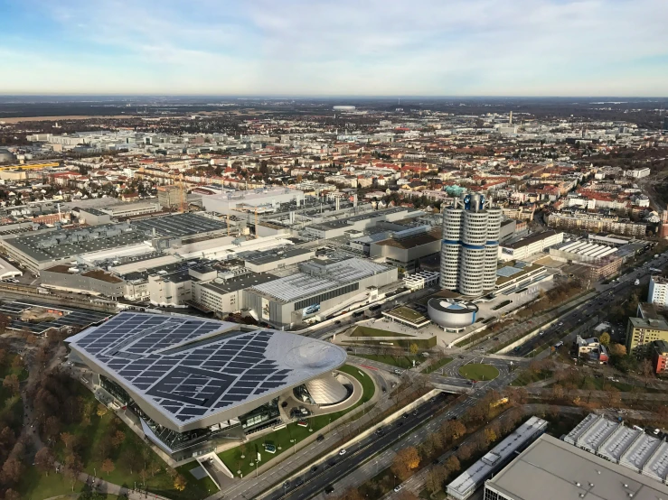 an aerial po of a city with the building next to it