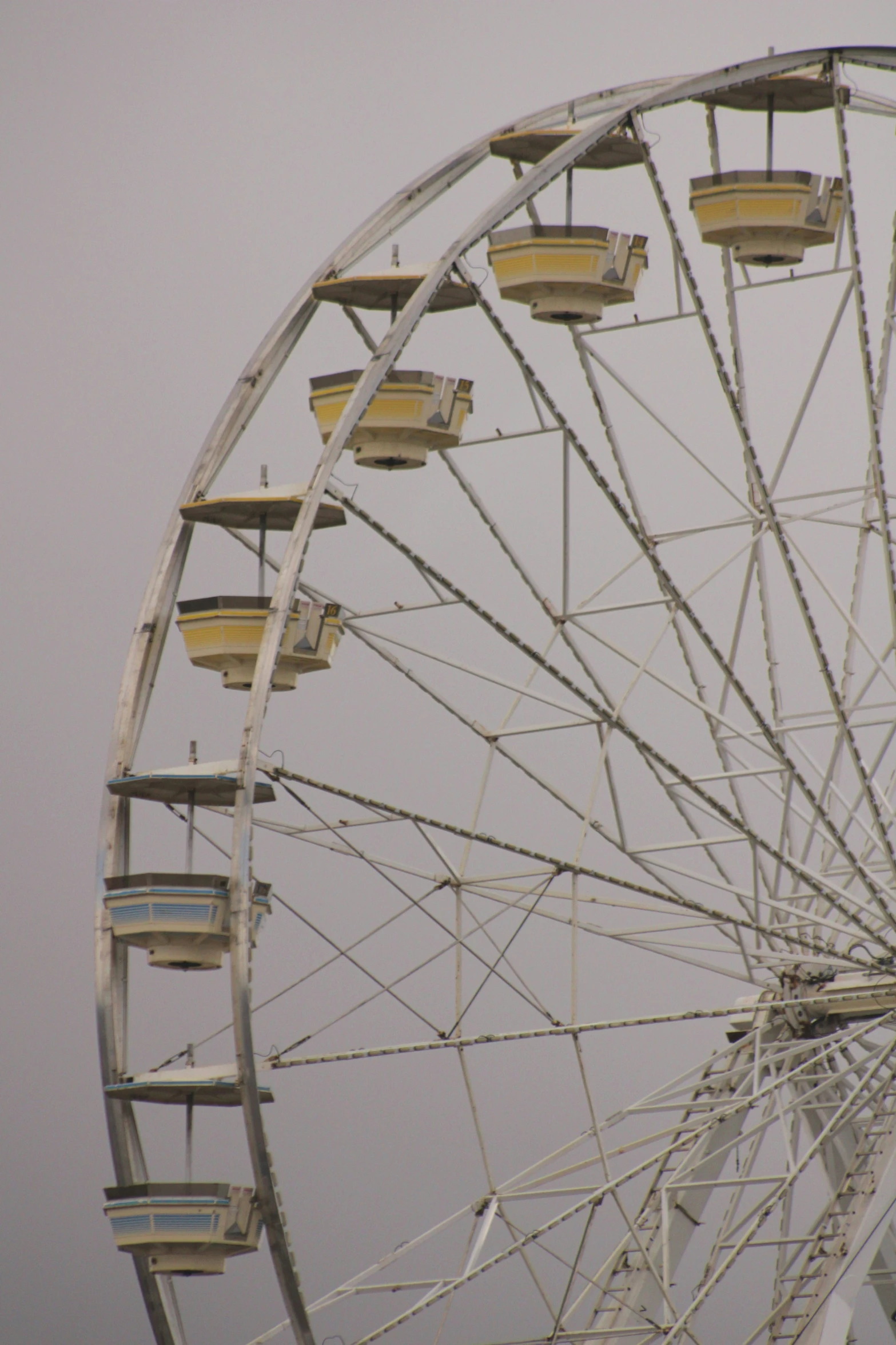 the big wheel is sitting alone in the rain