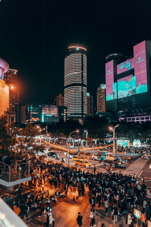 an intersection has lots of people and electronic devices on it