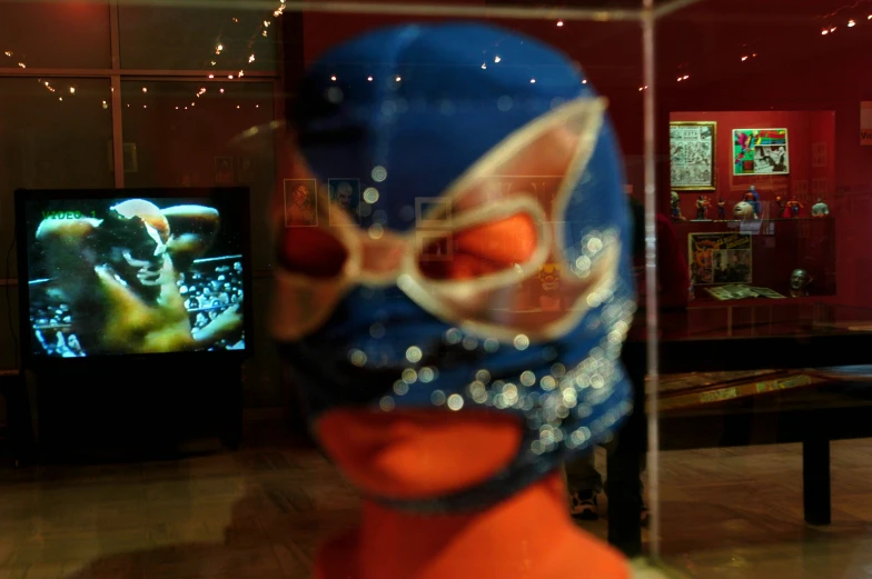 a close up of a person wearing a blue hat