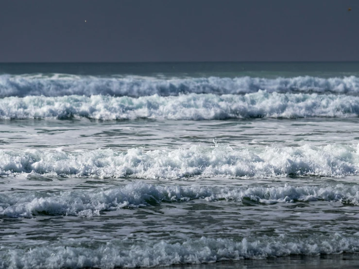 a man with a surfboard in the water