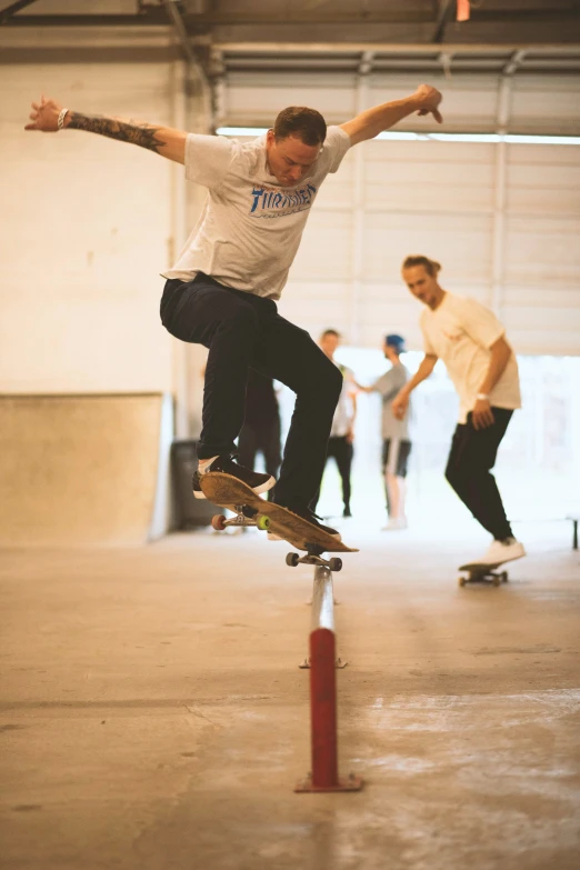 a man riding on top of a skateboard