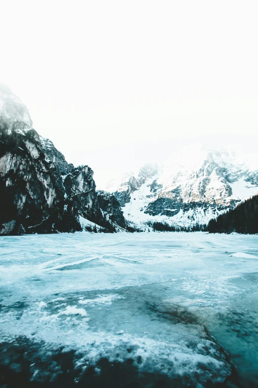 an image of a mountain landscape covered in snow