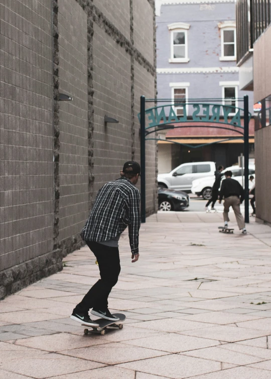 a guy is riding his skateboard in the street