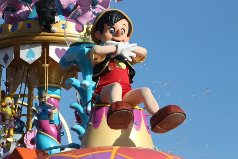 the mickey mouse rides on top of a carousel