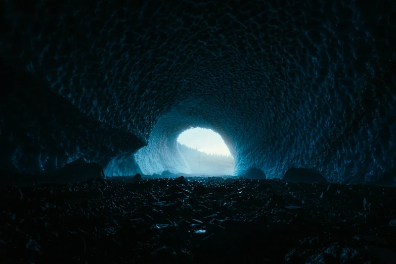 an image of a cave tunnel filled with ice