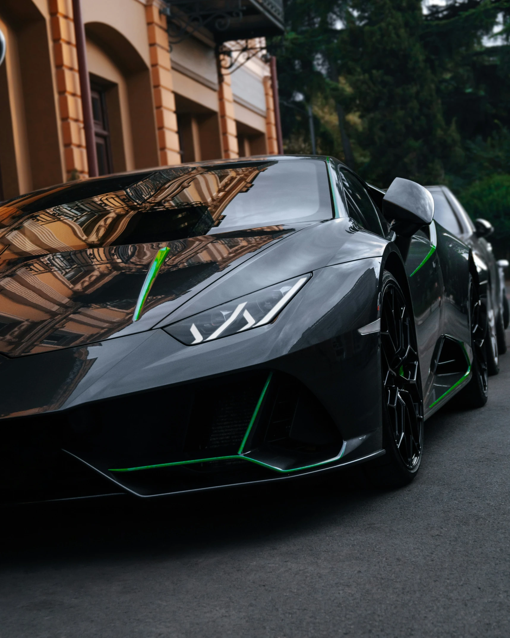 a black sport car is parked on the street