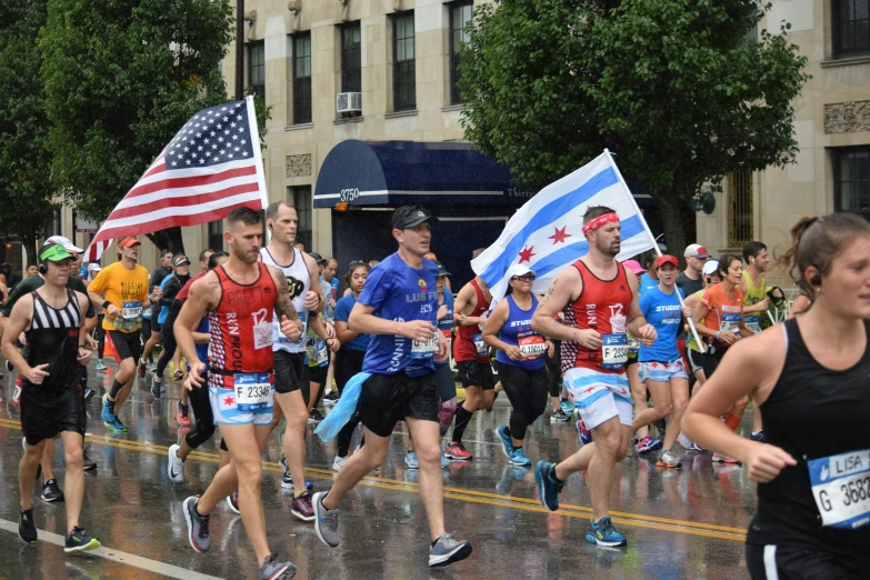 several people running in a race with flags