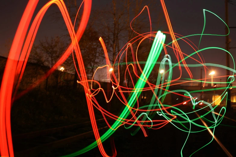 a colorful light painting on a dark street