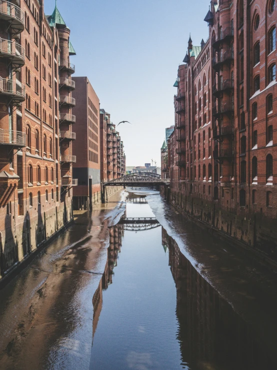 a river that runs through the middle of tall buildings