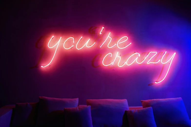 a room with neon lights that spell out you're okay