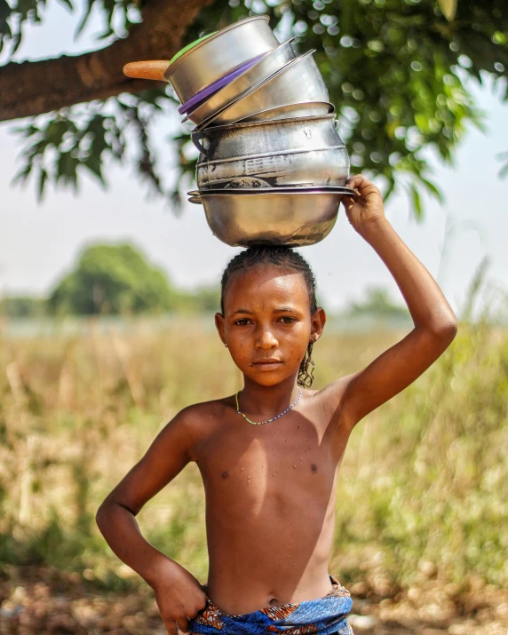 a  carrying two pots on his head