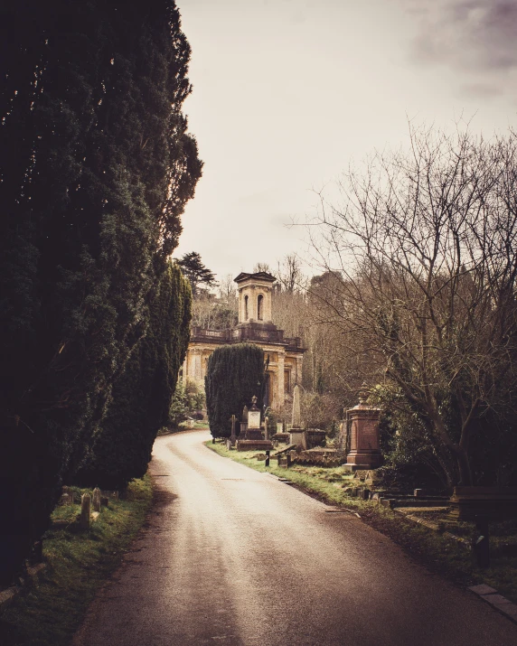 a long driveway leads to a stone building