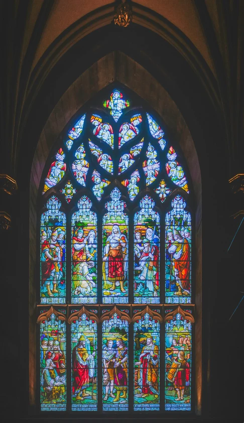 large, bright stained glass window in a church