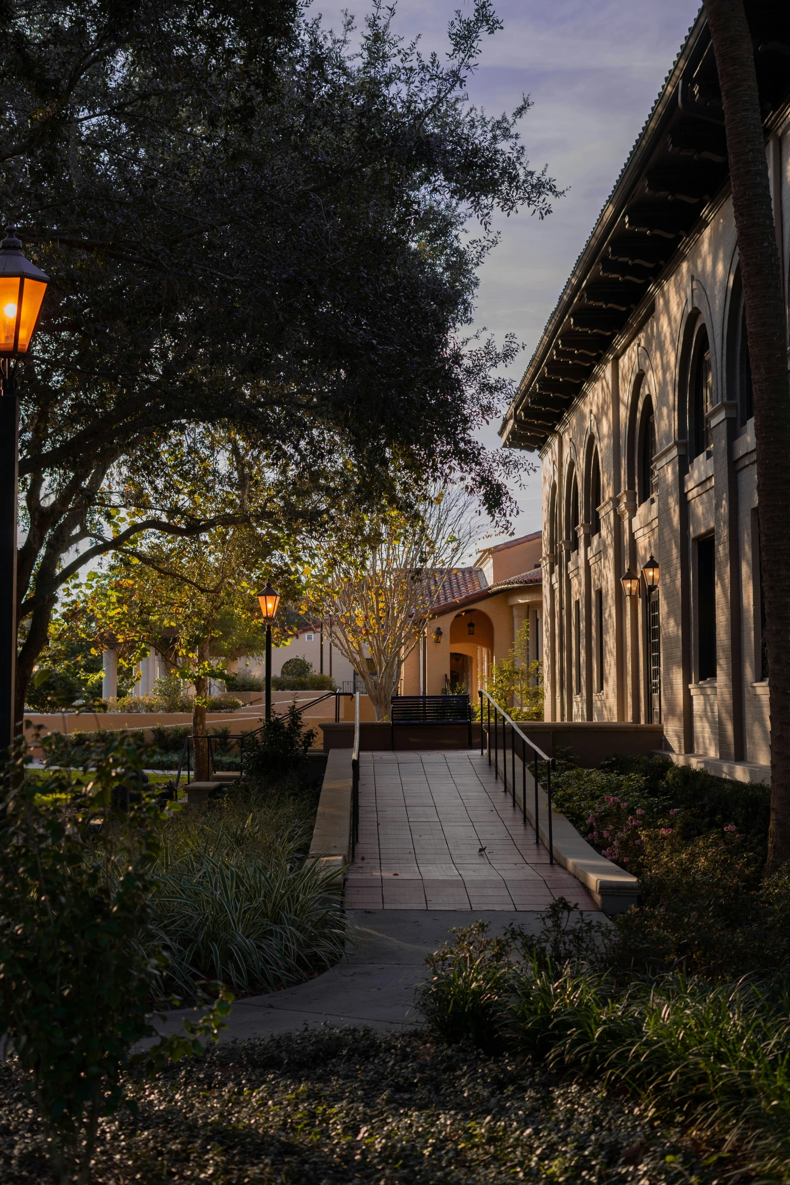 two lamps and a path in front of a house