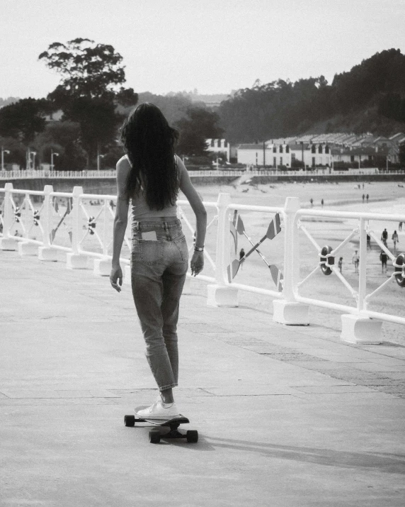 a woman riding on top of a skateboard