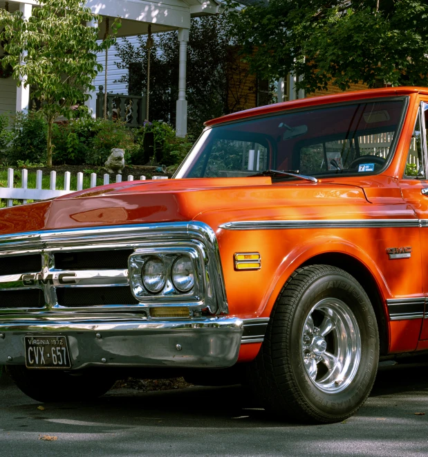 an orange truck is parked on the street