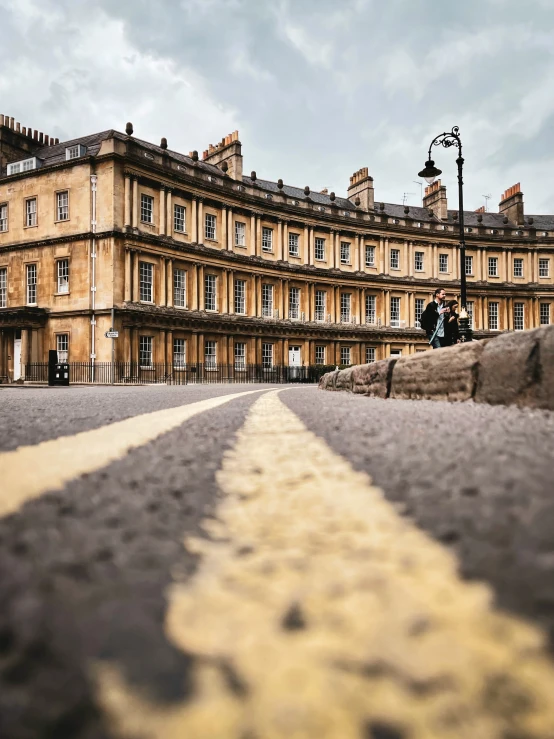 a long yellow striped down the middle of a road