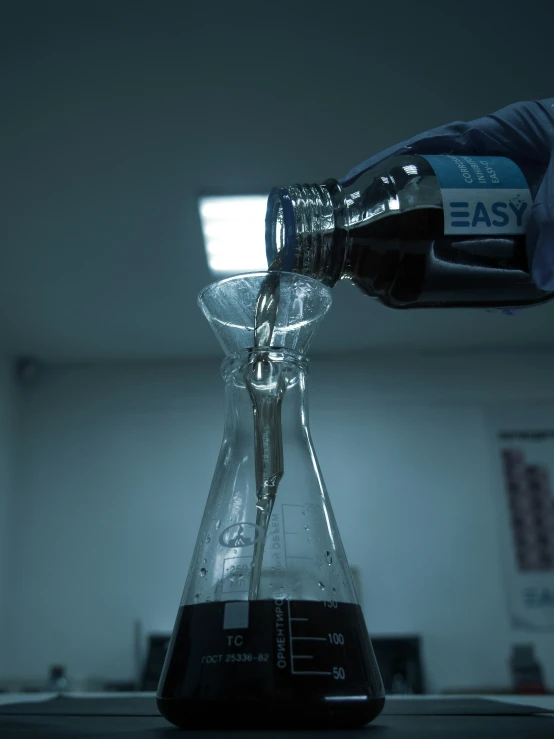 a beakle holding liquid with a thermometer inside